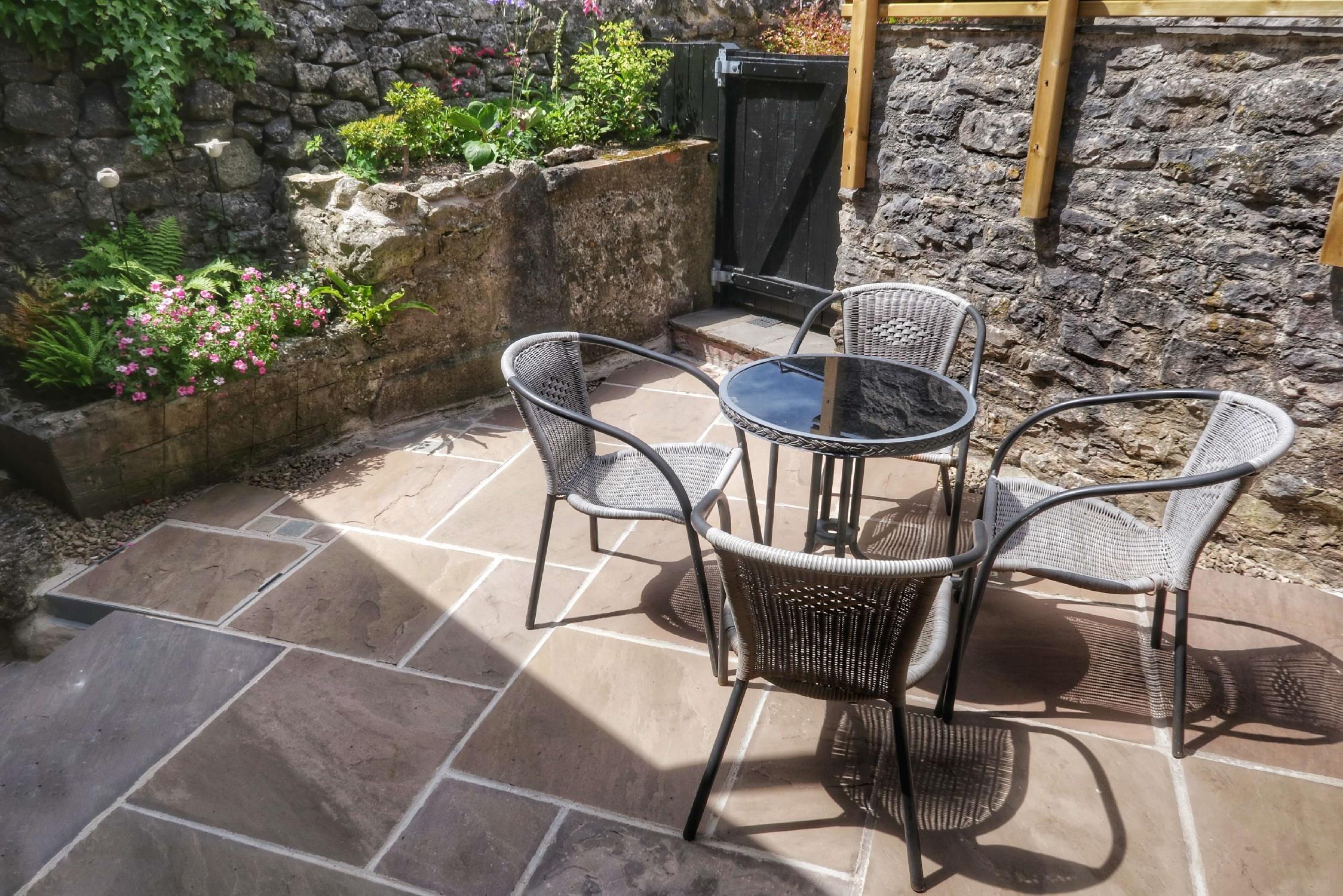 Relax in the rear courtyard at Eight The Green