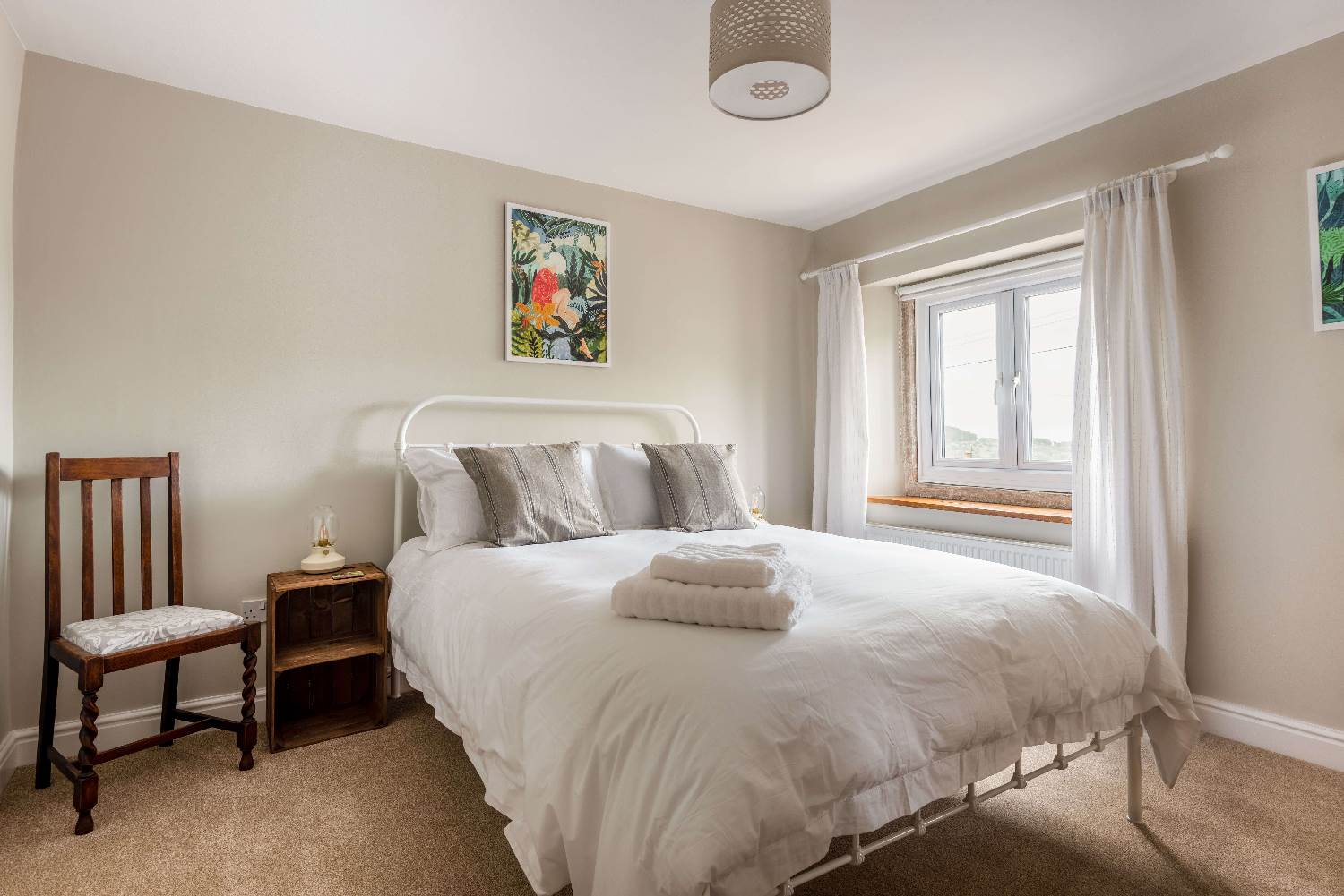 Eight The Green has a well-proportioned bedroom, with views to the village and countryside beyond